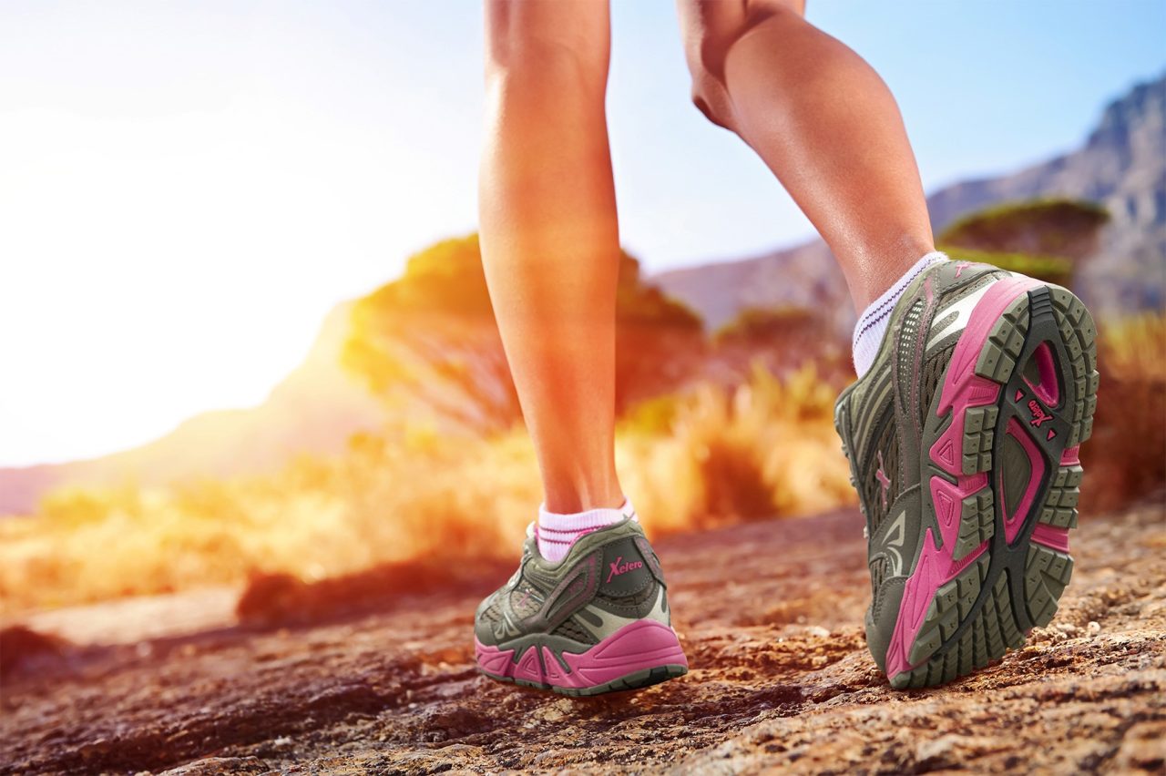 Picture of a woman's legs and feet while wearing Xelero shoes.